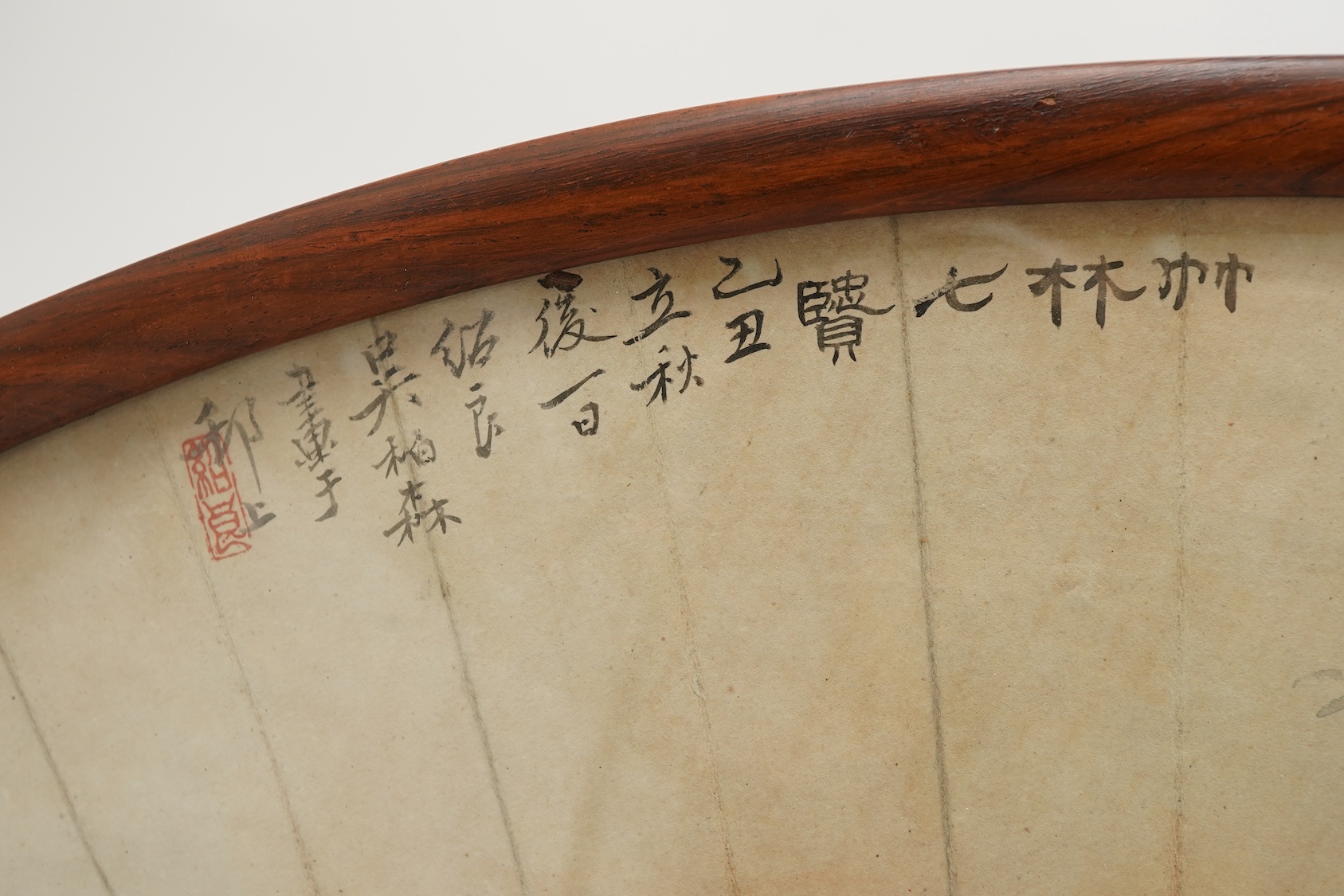 A Chinese painted paper fan leaf, 19th century, with hongmu frame and stand, early 20th century